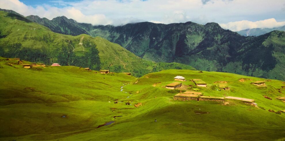 Breathtaking view of lush green hills and mountains in Haveli Azad Kashmir, perfect for a nature escape.